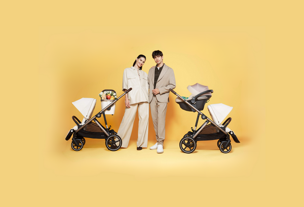 woman and man with two strollers